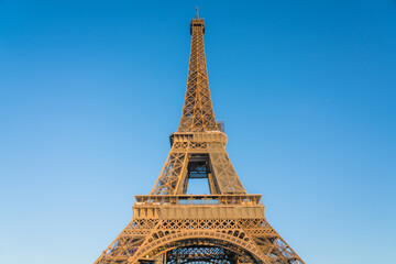Fototapeta na wymiar Eiffel Tower close up view against blue sky in Paris. France