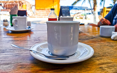Cup of americano black coffee on Holbox island Mexico.