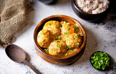 Fresh cooked meatballs in tomato sauce in a bowl