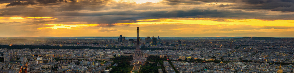 Aerial panorama of Paris with Eiffel Tower at sunset. France