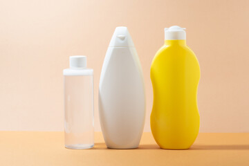 Body care products on a beige background, close-up