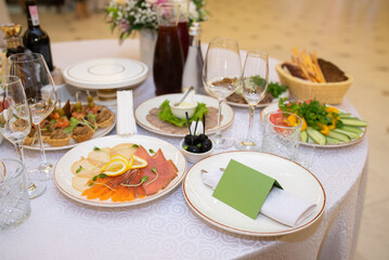 Server table with food in a restaurant, close-up