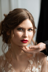 Woman bride in a wedding dress with a beautiful hairstyle, portrait, close-up