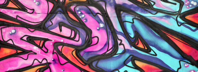 Colorful background of graffiti painting artwork with bright aerosol strips and beautiful colors....