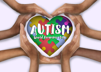 World Autism Awareness Day. People forming heart with their hands on white background, top view