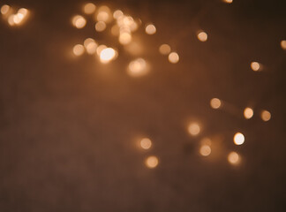 Golden and dark brown round bokeh lights festive background