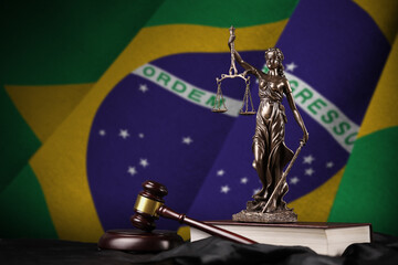 Brazil flag with statue of lady justice, constitution and judge hammer on black drapery. Concept of...