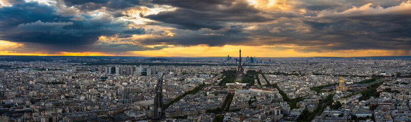Fototapeta na wymiar Aerial sunset panorama of Paris with Eiffel Tower in the center. France