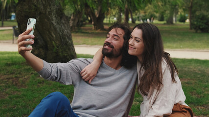 Close-up of couple in love taking selfie on mobile phone