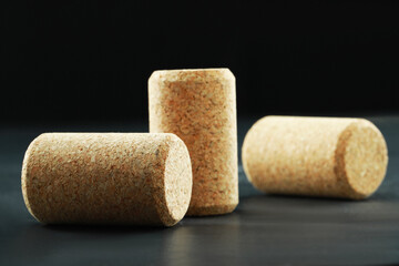 Corks of wine bottles on grey table, closeup