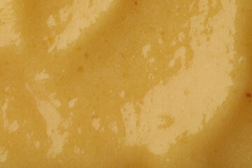 Tasty fresh fruit smoothie as background, top view