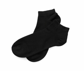 Pair of black socks on white background, top view