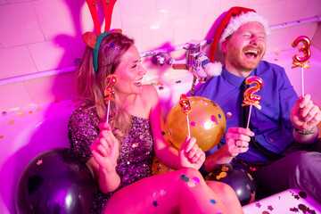 Couple having fun at New Year party