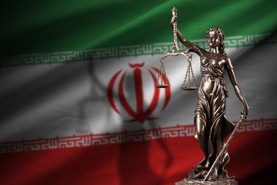 Iran flag with statue of lady justice and judicial scales in dark room. Concept of judgement and punishment, background for jury topics