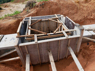 Melaka, Malaysia -February 2, 2022: Utility manhole under construction at a construction site. Built on site according to the engineer's design. Using plywood and timber as a construction mold