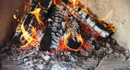 burning camping or grill fire with wild flames
