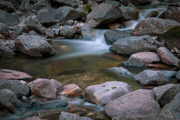 Naklejka na ściany i meble Long exposure flowing creek in yosemite national park