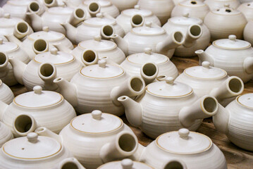 Traditional Japanese ceramic in Kyoto Pottery Village, white porcelain teapot (called kyusu) used for green tea