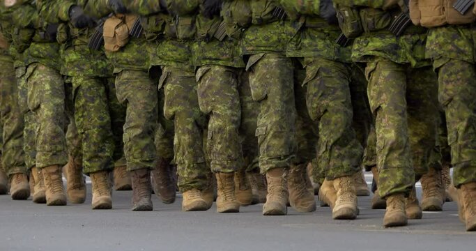 4K - Soldiers with weapons marching in formation