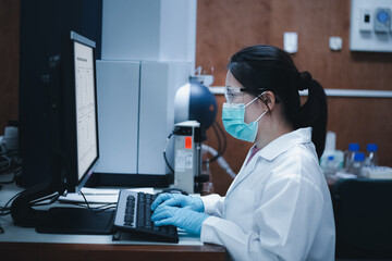 Side view shot, Scientist woman uses mass spectrometry and LC MS for the analysis of samples in the...