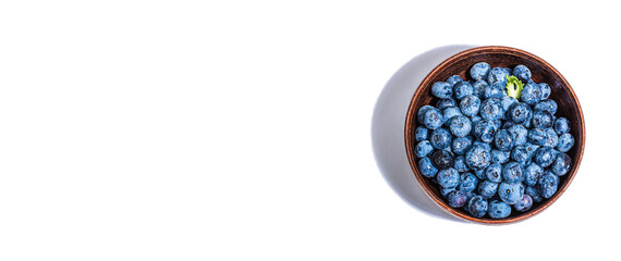 Bowl of ripe blueberries isolated on white background. Fresh fruits, ingredients of healthy food