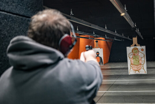 man with a gun in a Shooting range in Detroit