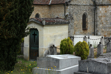 Fototapeta na wymiar Graveyard - Statue and old grave - Église Saint-Jean-Baptiste - Choisel - Yvelines - Ile-de-France -France
