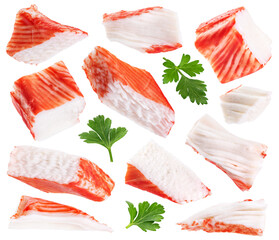 Crab sticks pieces and parsley isolated on white background. Collection with clipping path.
