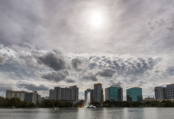 Fototapeta na wymiar Sunny Orlando skyline and Lake Eola in the morning with city skyscrapers.