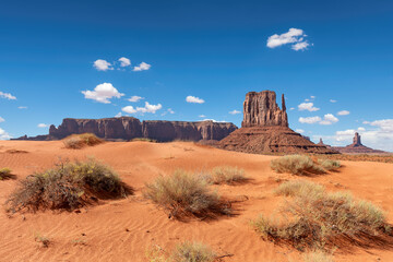 Sand desert in Monument Valley iconic rock formations in  Navajo Tribal Park , Arizona - Utah, USA