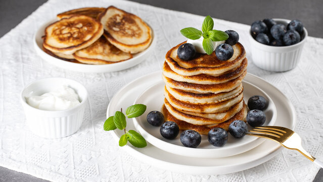 Breakfast pancakes with blueberries and sour cream