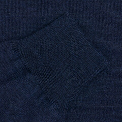 Blue wool sweater sleeve close up