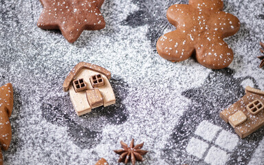 Collection of various gingerbread cookies in a box with fir branches
