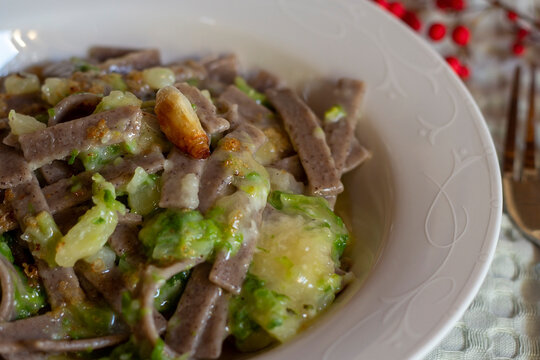 Pizzoccheri alla Valtellinese. Classically prepared in Valtellina (a small valley located in the Lombardy region of Northern Italy) or in Graub&uuml;nden.Closeup