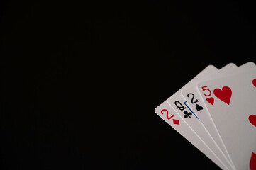 Playing cards showing new year 2025 on an isolated black background. Copy space.