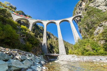 Swiss train over Landwasser Viaduct bridge in the alps, Graubunden, Switzerland