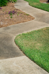 Curved concrete pavement near the grass- Destin, Florida
