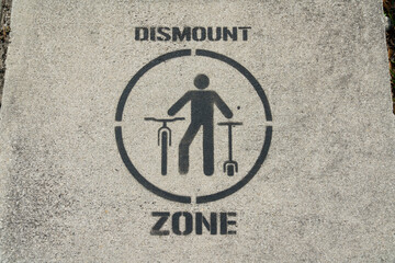 Dismount zone painted sign over the bridge at Miami, Florida