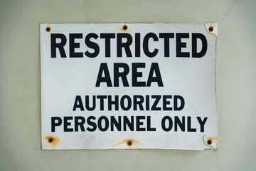 Screwed signage with rust and Restricted Area Authorized Personnel Only- Miami, Florida