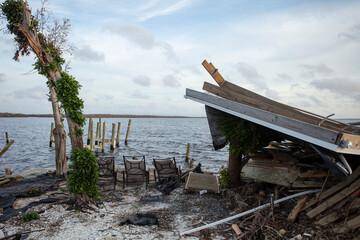 debris piled up on bridge in Matlaeshe Island, Cape Coral.