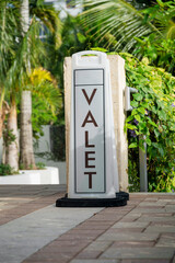 Floor-mounted Valet signage on a bricks pavement- Miami, Florida