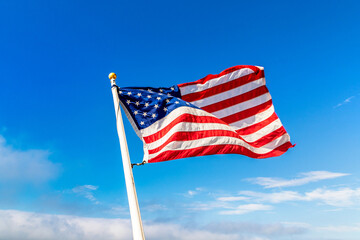 USA flag waving against sky