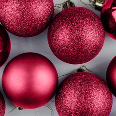 Color of the Year 2023 Magenta. Trendy background of Christmas shiny balls. Fashion carmine shade....