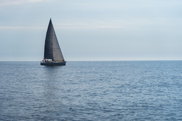 Sailing boat on blue open sea. Concept of Dream, adventure and freedom