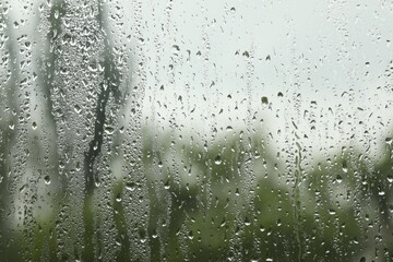 Window glass with raindrops as background, closeup