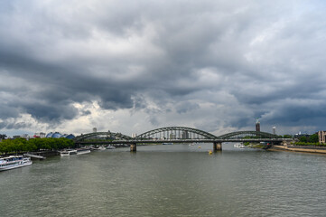 Rhine river, Cologne, Germany. Famous Hohenzollern Bridge at cloudy day. 