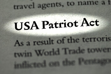 USA Patriot Act and World Trade Center highlighted in business ethics law book in bold font as result of terrorism - obrazy, fototapety, plakaty