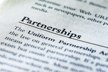 word partnership or partnerships written in text in business law book