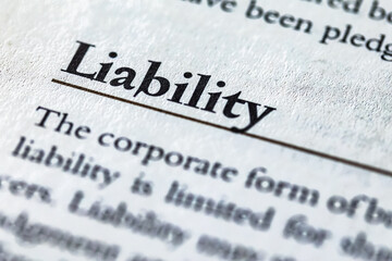 word liability printed in business legal law book or article - obrazy, fototapety, plakaty
