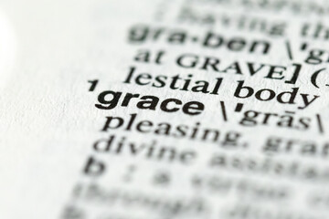close-up of the word grace in the dictionary, Christian or Christianity definition and meaning